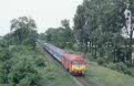 MAV M41 2166 + 4 MAV coaches as passenger train R 365 (Budapest Nuygati, H - Oradea, RO) arrives at Biharkeresztes (H) on 9 June 2002
