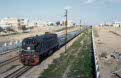 SNCFT GE DN-311 + phosphate train from Sfax to Metlaoui at Nakta on 2 March 2003