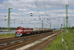 MTMG M61-010 (NoHAB-GM Foundation) brings the second string of tank cars from Lbatlan to Gyor along the Danube river at Komrom on 8 May 2015.