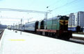 UZ ChME3-1849 uses one UZ coach to shunt UZ ER1-62 EMU to another track! Evpatoriya Kurort (UA), 26 April 2005.