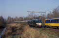 Historic Stichting Mat'54 Hondekop-Vier electric EMU 766 and Nederlands Spoorwegmuseum EMU 273 pull out of Deventer as chartertrain 28309 'West Falen Express' on its way from Utrecht to Enschede on 8 December 2001, meeting a modern NS ICM Intercitytrain