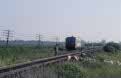 CFR 77 0999 + 77 0091 (from left to right) as passenger train PM 3734 (Graniceri Hm, RO - Santana, RO) approach Nadab (RO) not without risk on 12 June 2002