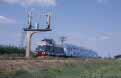CFR 80 0326 + 4 CFR double-deck coaches as passenger train P 2687 (Timisoara Nord, RO - Sannicolau Mare, RO) approach Lovrin (RO) on 13 June 2002
