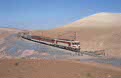 ONCF E-1207 + 2 ONCF ex-NMBS K2 coaches + freight wagons as TSP excursion train from Casablanca Voyageurs (MA) to Marrakech (MA) at Mechra-Benabbou (MA) on 13 October 2002