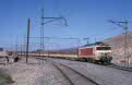 ONCF E-1313 + 7 ONCF Corail coaches + 1 ONCF Diekirch coache as passenger train 2/65 from Sidi Kacem (MA) to Marrakech (MA) at Mechra-Benabbou (MA) on 13 October 2002