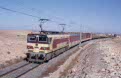 ONCF E-1110 + 1 ONCF Diekirch coach + 2 ONCF ex-NMBS K2 coaches + freight wagons as DGEG excursion train from Benguerir (MA) to Safi (MA) at Youssoufia (MA) on 13 October 2002