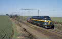 TSP 202.020 (ex-CFL 1602) + waggon transport 16105 (Antwerpen Noord - Ronet) at Gemloux (B), February 2002