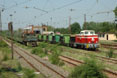 Galabovo mine loco 91 pulls a coal train from the stock pile to the mine at Galabovo mine (BG) station 'Razdelna' (which is not situated at the namesake town further west) while overtaking Galabovo mine 52.275 with a ballast train, 30 June 2005.